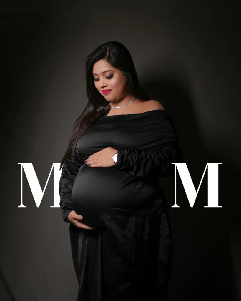 Elegant black gown maternity portrait in Asansol studio